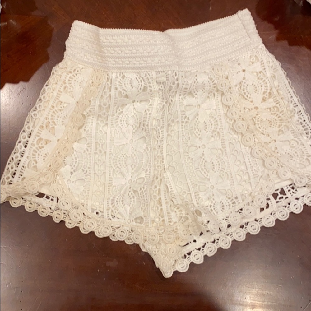 Cream colored, two tone embroidered shorts